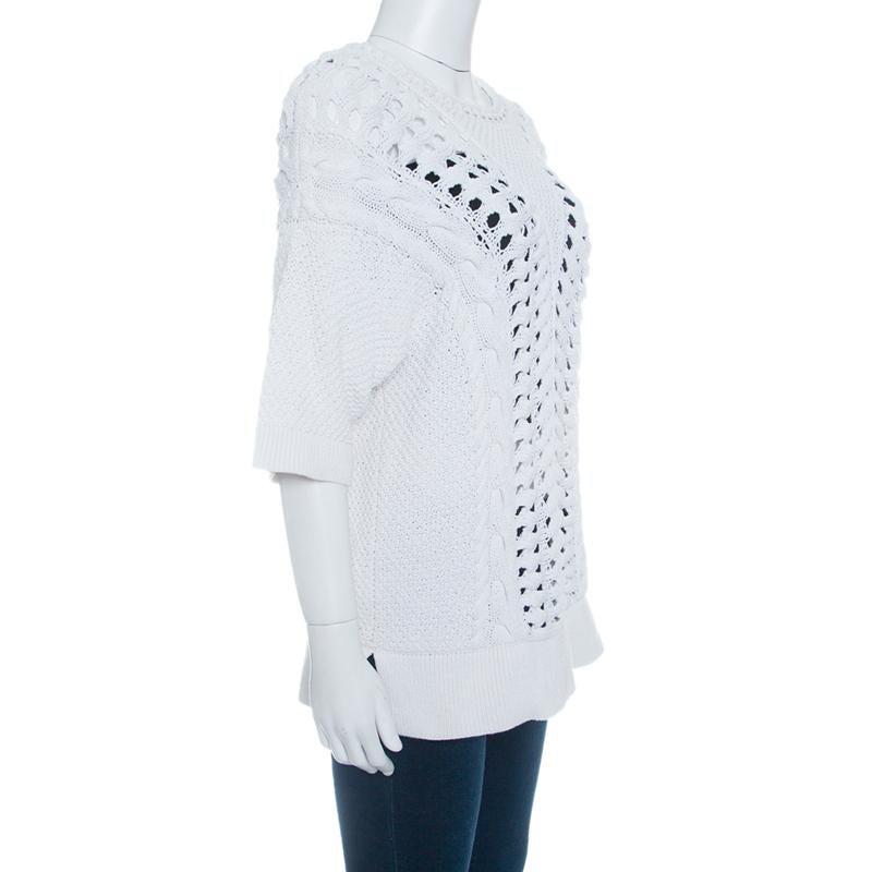 Made from a combination of cotton and nylon, this Thakoon top features an off-white body with chunky perforated knit and finished with rib trim. It offers a relaxed fit to the wearer and completed with short sleeves. Wear with a contrasting bralette