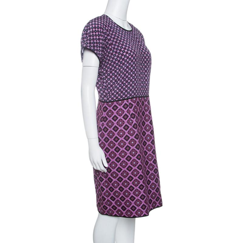 Prep up for an event in this fantastic purple dress. Cut from the finest silk, this will be your go-to outfit for any occasion. Featuring an intricate diamond pattern all over, one can flaunt an effortless style with this Victoria Beckham