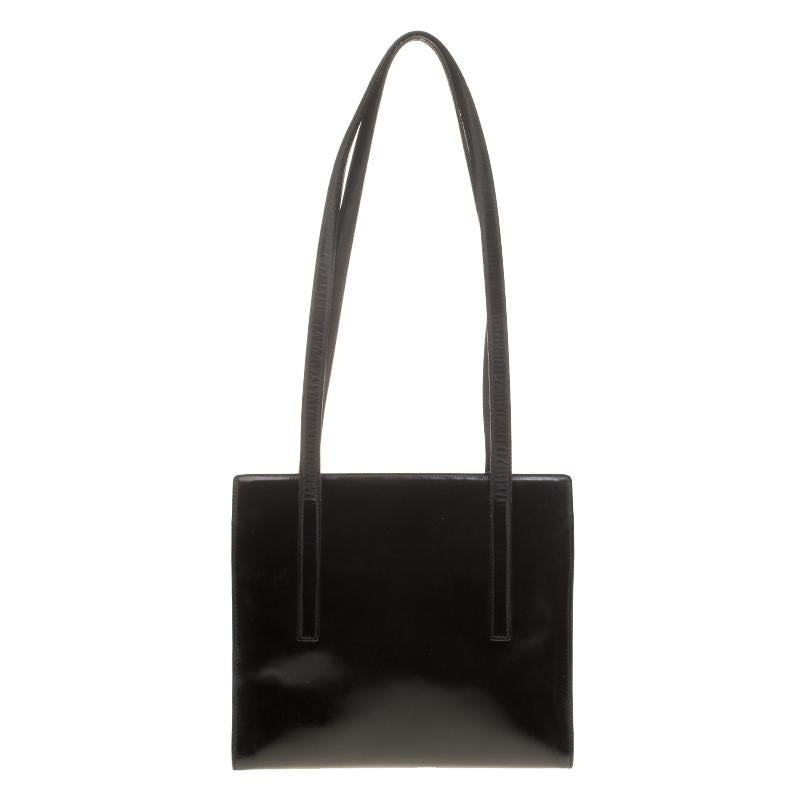 This well-made leather tote from Prada combines sophistication to turn up your fashion game. The black shade looks sleek to pair with multiple outfits. It has two shoulder handles and a nylon-lined interior, splendid for your essentials.

Includes: