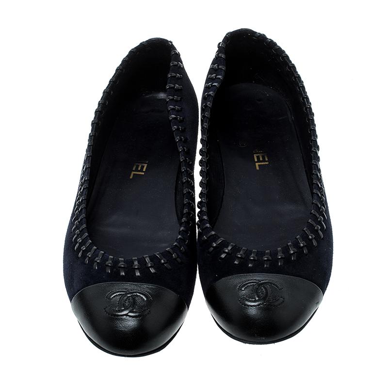 Cute, comfortable and versatile, these Chanel flats are perfect for those long days. It is designed from a black suede body and trimmed with a leather cap-toe. Detailed with whip-stitching, this pair surely will make a stand-out piece in your