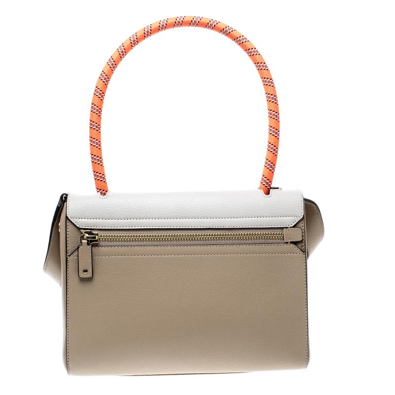 One of the latest styles of Anya Hindmarch, this small Bathurst satchel is accented with a contrasting off-white panel featuring hand motif on the front. Superbly structured, the bag exudes elegance and poise from its understated beige hue and