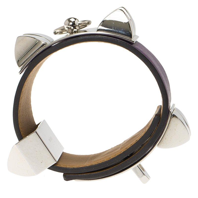 This purple bracelet by Hermes is bold and striking. Crafted from calfskin leather and the signature palladium plated metal, it features the Collier de Chien detailing along with an adjustable fit.

Includes: Original Dustbag,Original Box

