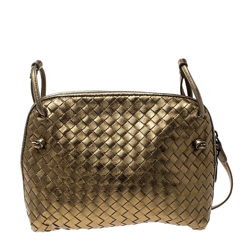 Coming from the house of Bottega Veneta, this crossbody bag is a great alternative to your regular bags. Crafted in a golden leather body with Intrecciato weave pattern, this bag comes with a top zipper closure and fitted with a slim shoulder strap.