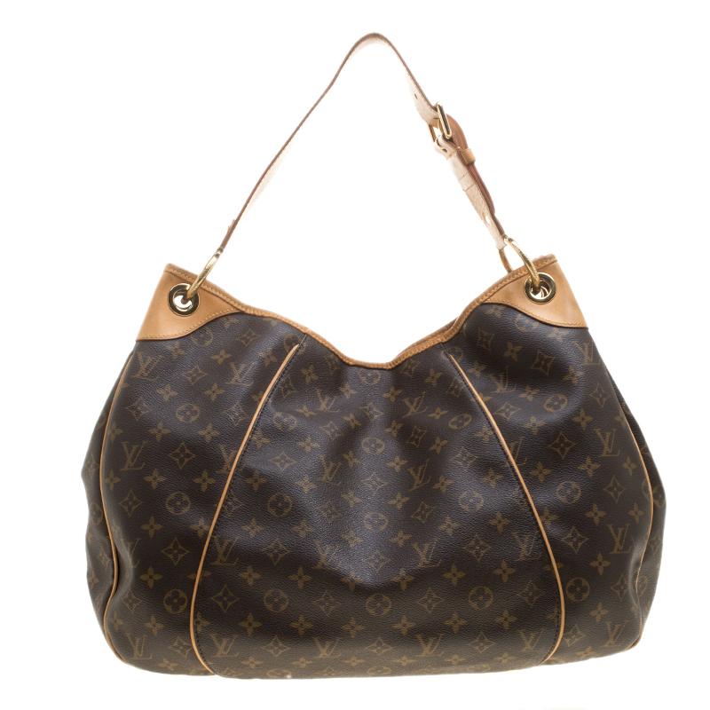 It is every woman's dream to own a Louis Vuitton handbag as appealing as this one. Crafted from their signature monogram canvas, this bag features a single handle, a snap button, and gold-tone hardware. While the front brand plaque elevates its