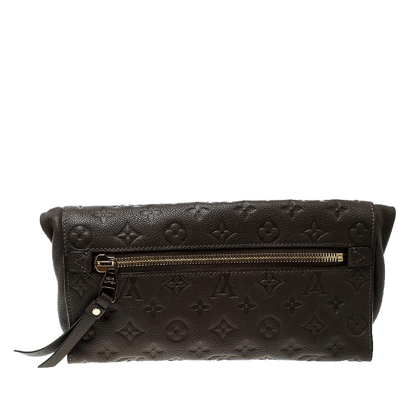 Complete your look with this chic and cool Louis Vuitton Petillante clutch. Artistically crafted from Monogram Empreinte leather, this clutch has dual zip pockets on the exterior, one on the front and the other on the rear. It has a comfy interior