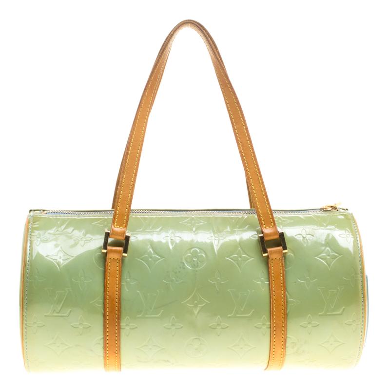 Another classic from the house of Louis Vuitton is this beautiful Bedford. The mint green bag is made from the signature Monogram Vernis patent leather that was introduced in 1998, lending it a shiny and glossy effect. In shape, it resembles their