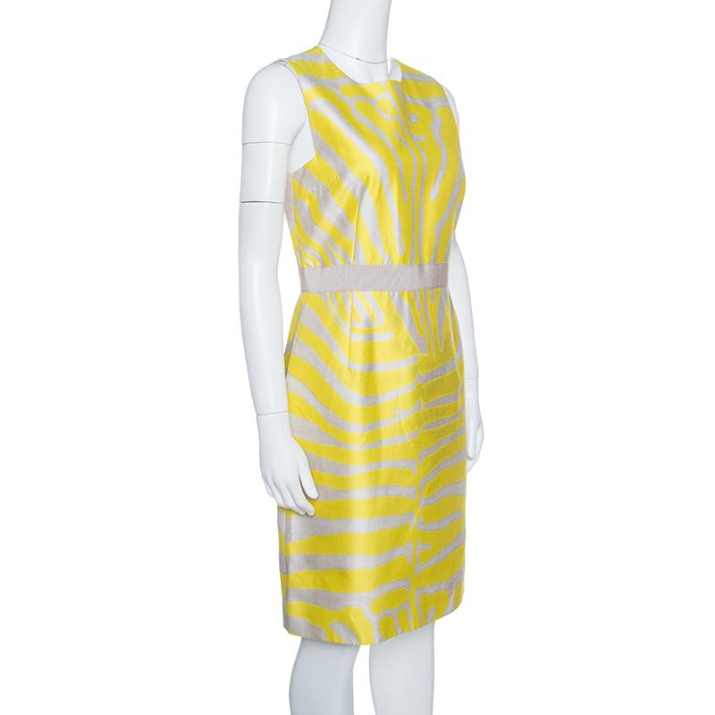 Giambattista Valli's zebra striped dress fuses the best of both smart and casual worlds. Fabulously crafted from cotton and silk, the sleeveless dress is adorned with yellow and grey zebra print. Secured by a concealed zipper at the back, it is