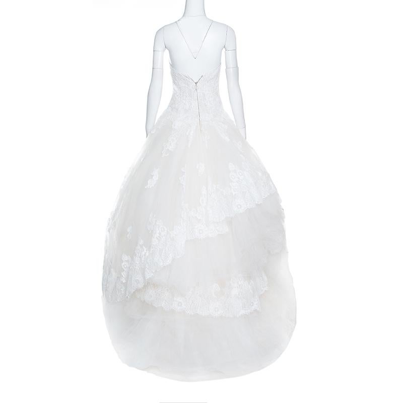 Make your wedding magical with this splendid wedding dress from Monique Lhuillier. Look breath-taking and picture-perfect as you don this strapless wedding dress which is designed with a lace bodice and tulle sweeping A-line skirt for a romantic,