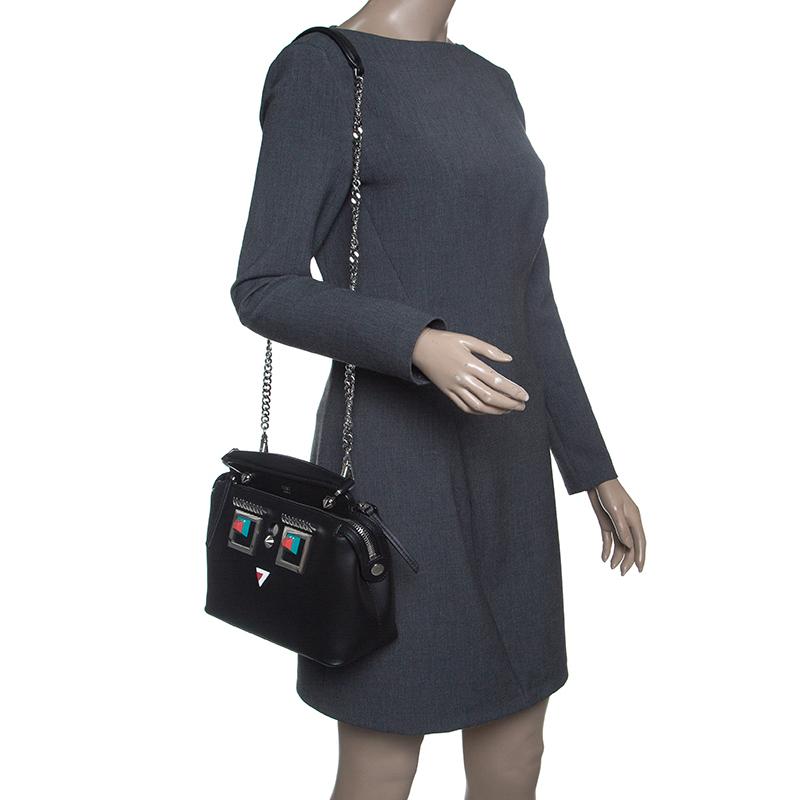 We are in love with this Dotcom bag from Fendi. Breathtakingly crafted from leather, the bag has a silhouette that will have people drooling. It has adornments on the front that lends it a fun touch, and the top zipper reveals suede interiors