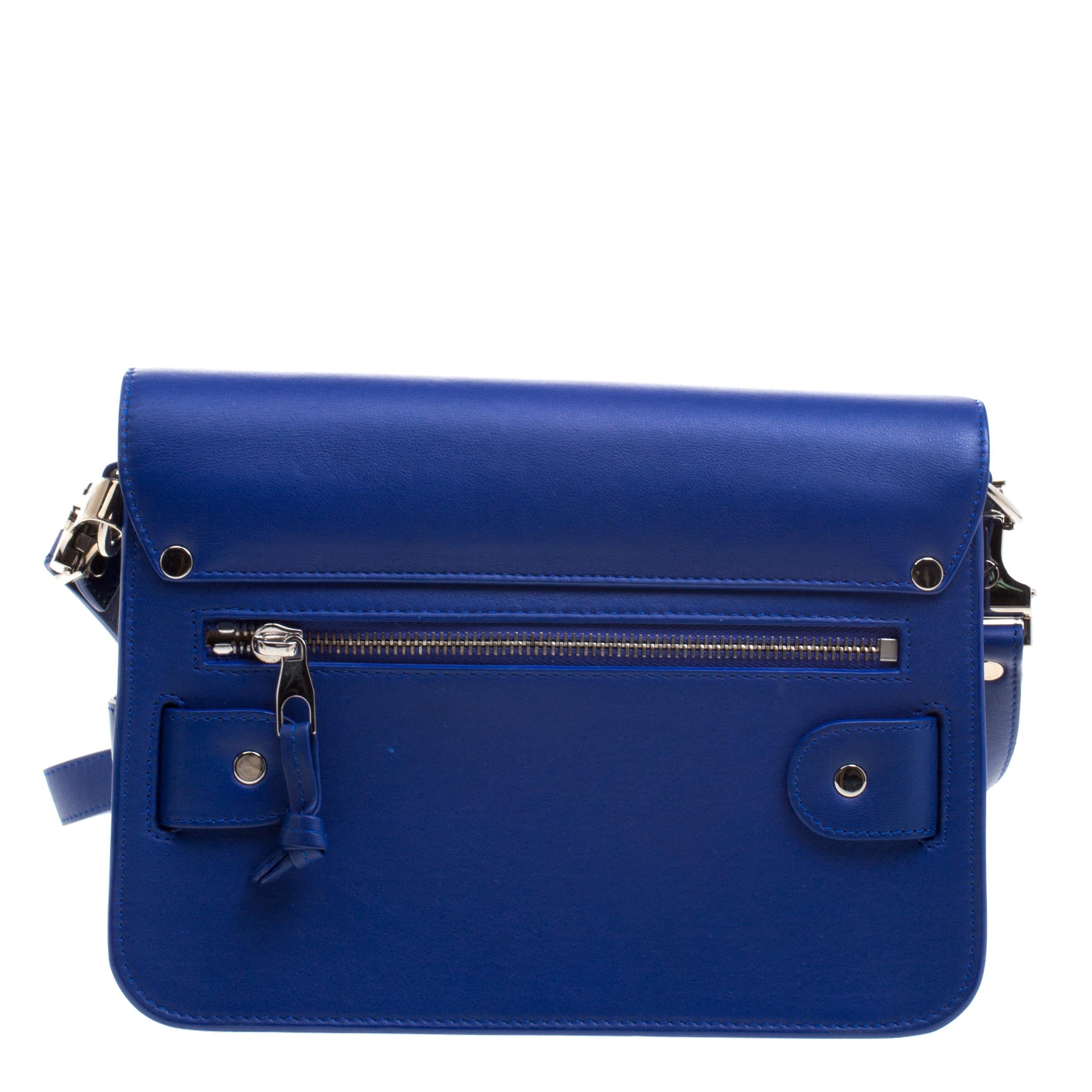 This stylish Classic PS11 shoulder bag from Proenza Schouler is sure to grab attention! Crafted from blue leather the bag comes with a removable shoulder strap and can be used as a clutch. The interior is fabric lined and sized perfectly to hold