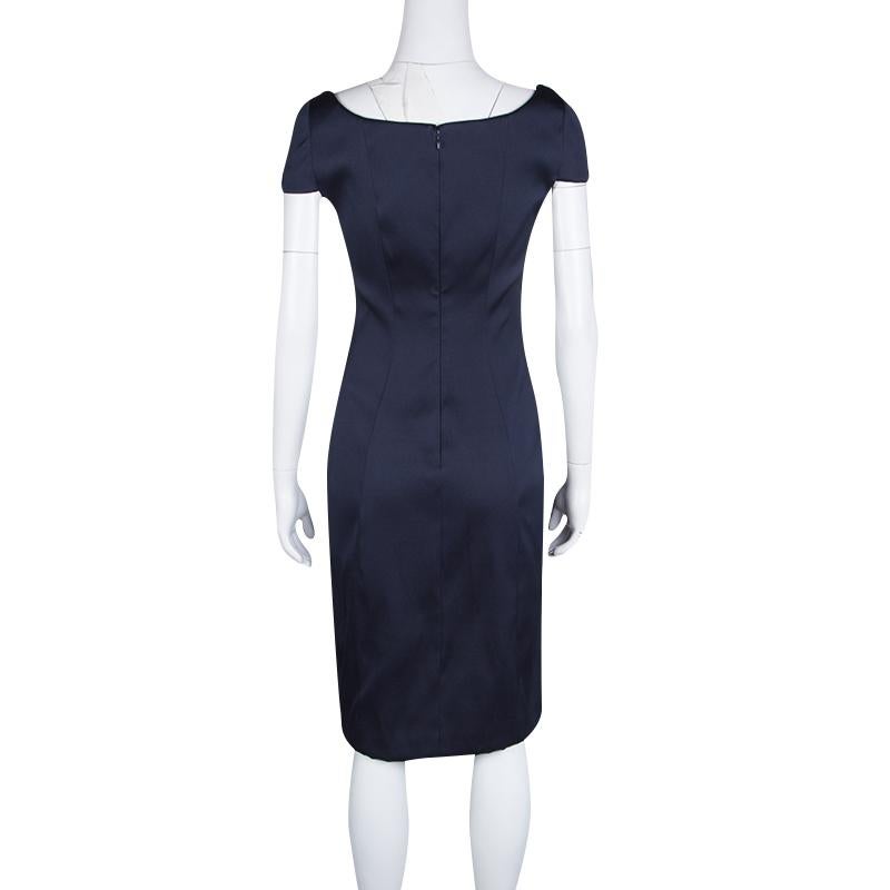 Keep it simple and classy with your formalwear wardrobe with this dress from the house of Prada. The simple cap sleeves is beautifully complemented with the bold neckline and the perfectly sculpted fit of the dress. This silk blend dress also