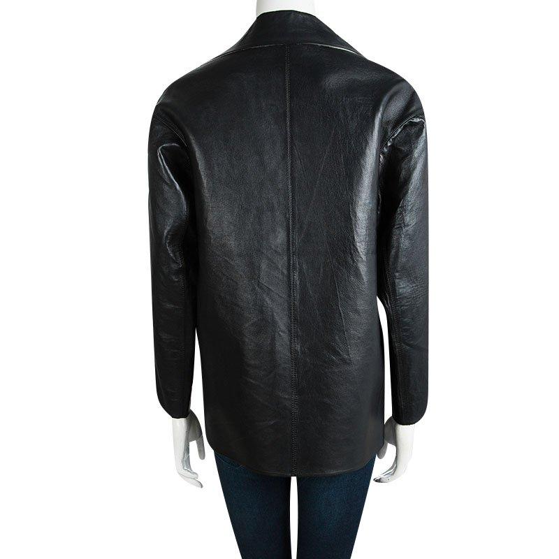 If classy is what defines you, then this black jacket from Marni is just perfect. The jacket is made of a cotton and leather blend and features a simple structured silhouette. It comes with notched lapels and an overlapping front closure. This