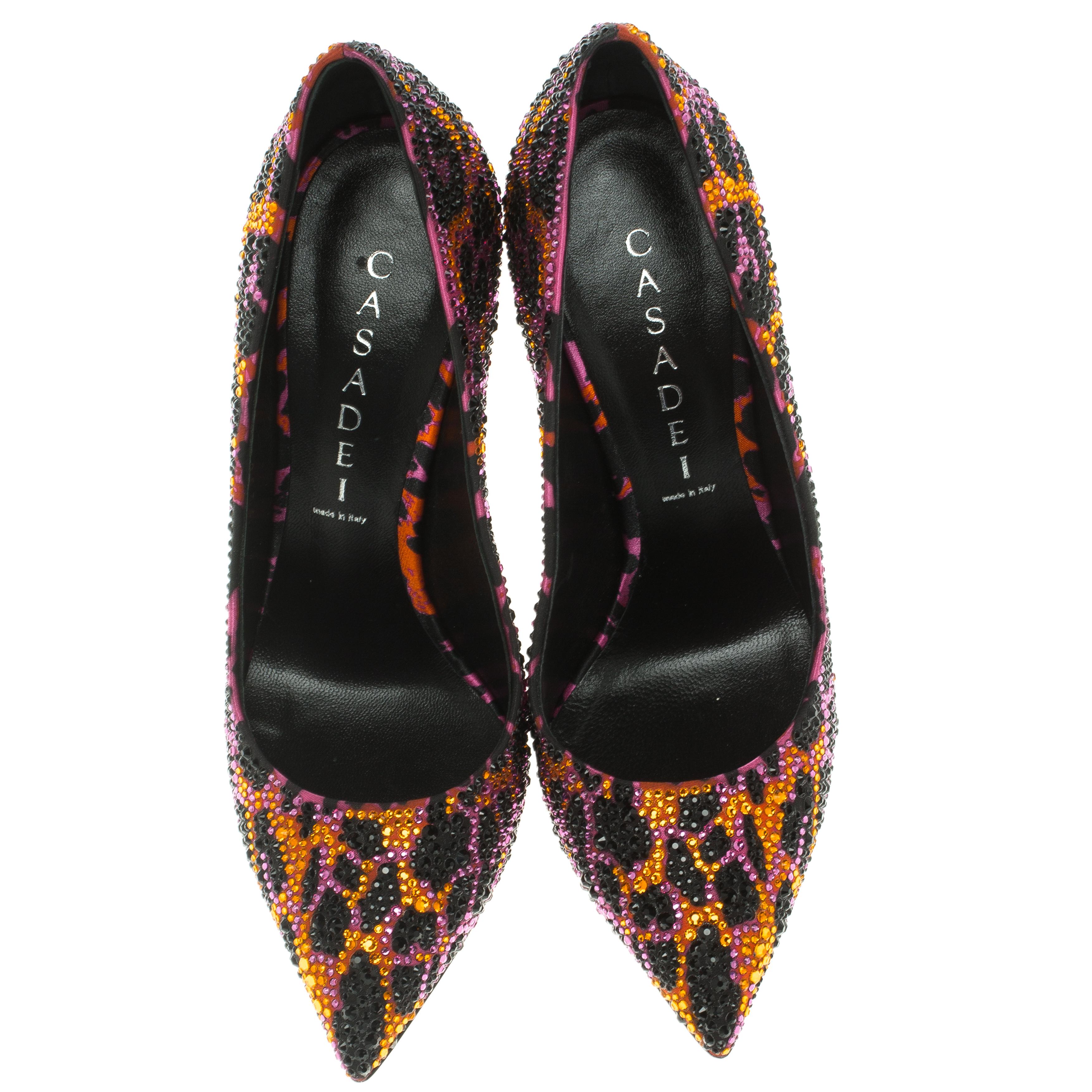 Don't you just wanna grab these pumps and try them on? They're beautiful to look at and versatile in design as well. Crafted from leather, these Casadei pumps carry an animal printed exterior lined with crystals along with pointed toes and blade