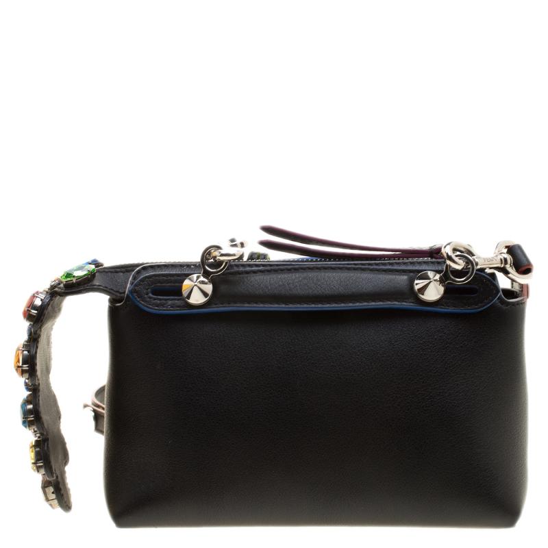 A new design from Fendi, this mini, By the Way Crossbody bag is made from black leather. Complemented by silver-tone hardware, it has a long shoulder strap for cross-body wear. Its main compartment has room for the essentials and is secured by a zip