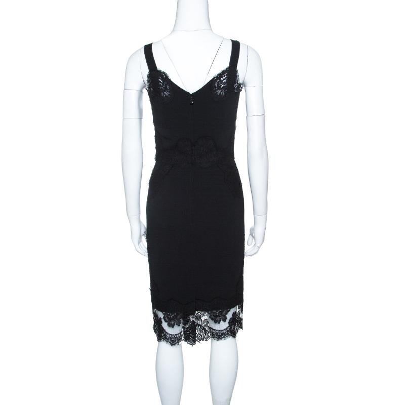 Dolce and Gabbana is loved for their dramatic and lush designs. The scalloped lace trims add a feminine feel to this black sleeveless dress. Designed with a fitted silhouette, this gorgeous dress will give an instant style elevation. Wear this to