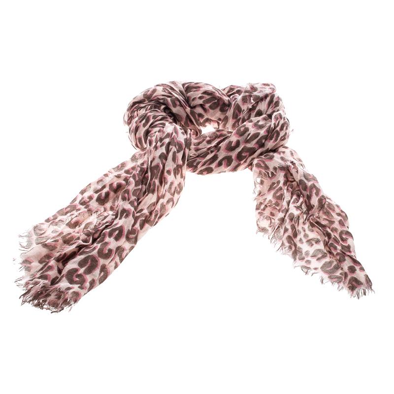 This funky Stephen Sprouse Graffiti scarf is a fun way to accessorise your casual outfits. This scarf from the house of Louis Vuitton features a bright pink and brown leopard print all over. It is cut from a blend of silk and cashmere and is