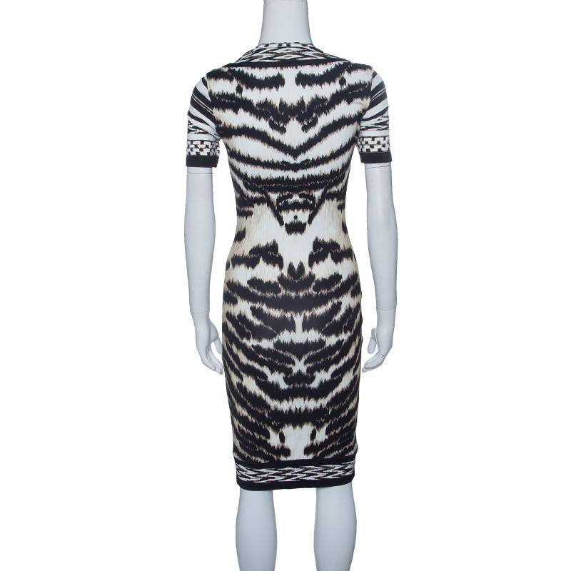 Opt for this knee-length Roberto Cavalli creation if you are looking for a luxurious and contemporary feel. Made using blended fabric, this multi-color animal print dress features short sleeves, a round neck and a bodycon fit.

Includes: Packaging