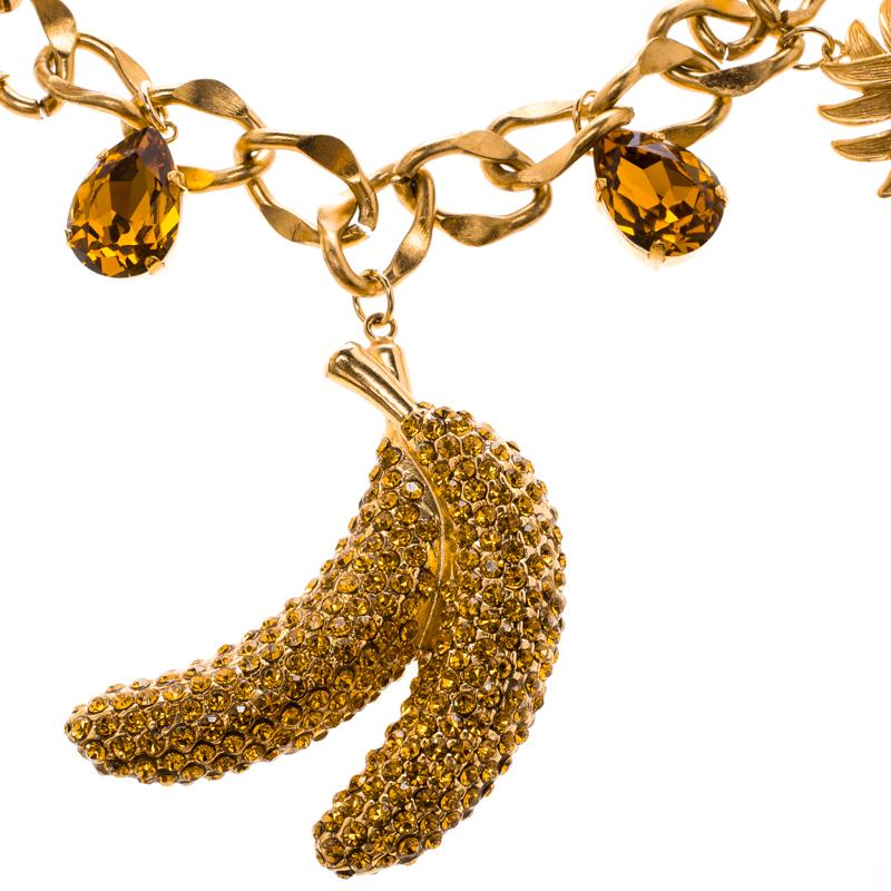 Designs by Dolce&Gabbana are not only well-made but are loaded with wonder and sweetness. This necklace, for example, is so unbelievably pretty. Made from gold-tone metal, the neckpiece has dangling crystal drops, leaf-like motifs and two bananas