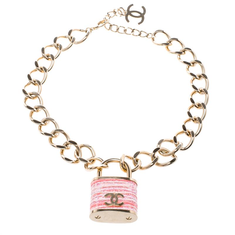 Made out of gold tone metal, this flawlessly crafted necklace by Chanel can be your next prized possession. Featuring high artistry, the design involves a CC padlock held by chains with a lobster clasp. The best part about the piece, however, is the