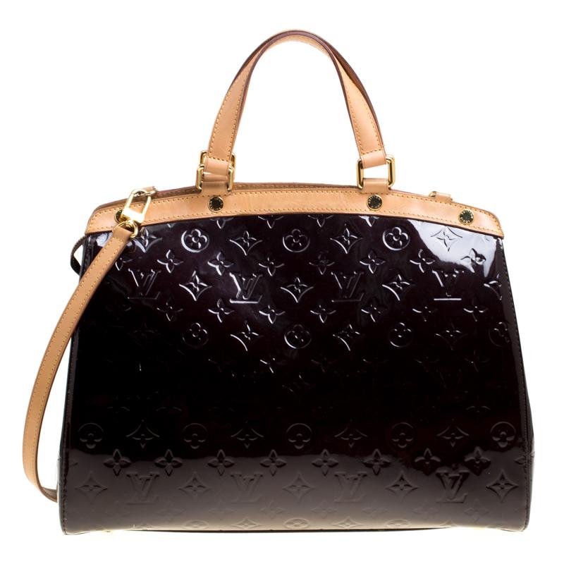 Louis Vuitton Brea's feminine shape is inspired by the doctor's bag. Crafted from signature Louis Vuitton Monogram Vernis, the bag has a polished finish. The fabric lined roomy interior is secured by a zipper. The bag features double handles, a