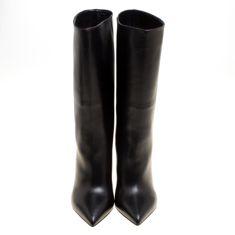 It's time to rock all your outings with these chic and smart mid calf boots from Valentino that exude oodles of style. These black boots are crafted from leather and flaunt pointed toes, leather lined insoles and a 10 cm heel. Pair these beauties
