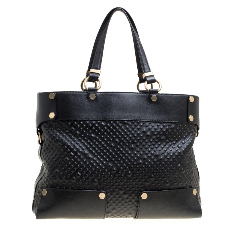 This Medusa tote from Versace is a fabulous piece. The bag comes in a luxurious black exterior made from textured leather and designed with their signature Medusa on the front and a spacious satin interior. It features dual top handles, gold-tone