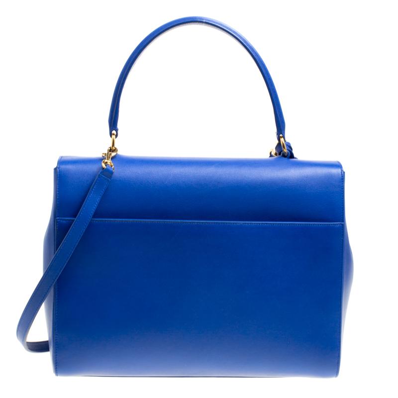 Whether it is your Monday meeting or an off-duty outing with friends, Moujik top handle bag is a splendid pick for any occasion. This blue bag beautifully embodies the spirit of extravagance and feminity that this luxury brand carries. From the
