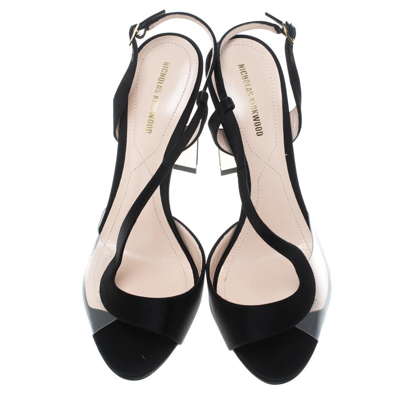 These Maeva sandals from Nicholas Kirkwood are simply irresistible and they wait for you to wear them. The gorgeous black sandals are crafted from satin and feature a peep toe silhouette with artistic PVC detailing on the vamps. They flaunt gold