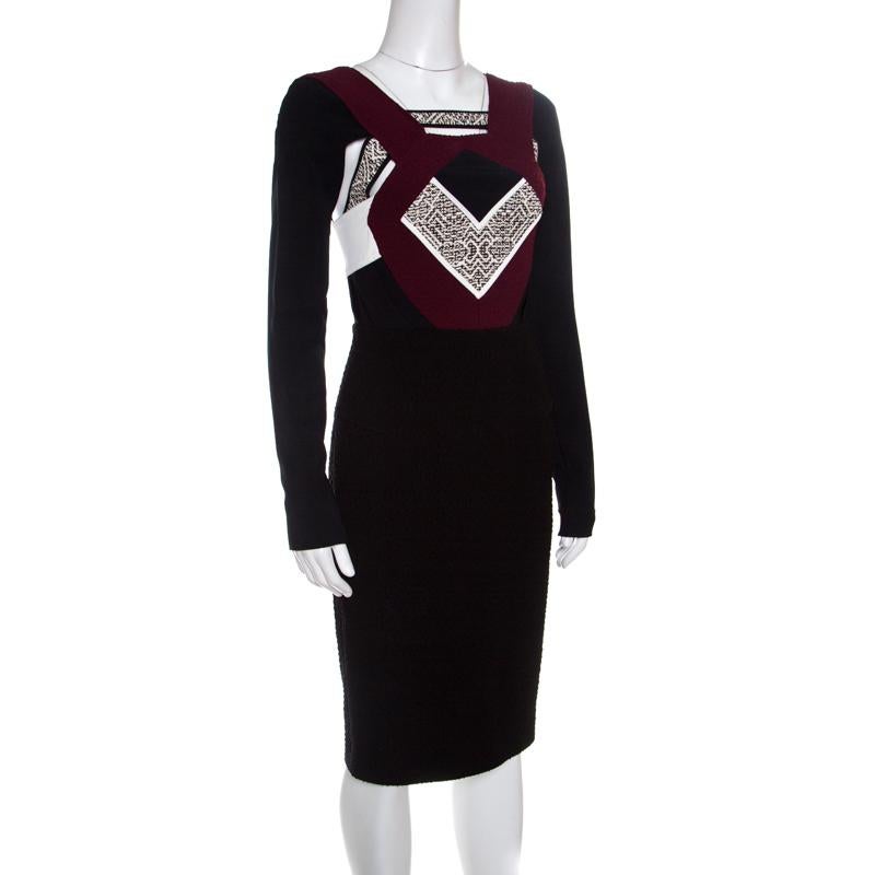 The very lovely Shapur dress from Roland Mouret is sure to capture your attention. The dress is made of a blend of fabrics and features a colorblock jacquard pattern on the bodice. It flaunts a square neckline, creative cutout detailing and a long