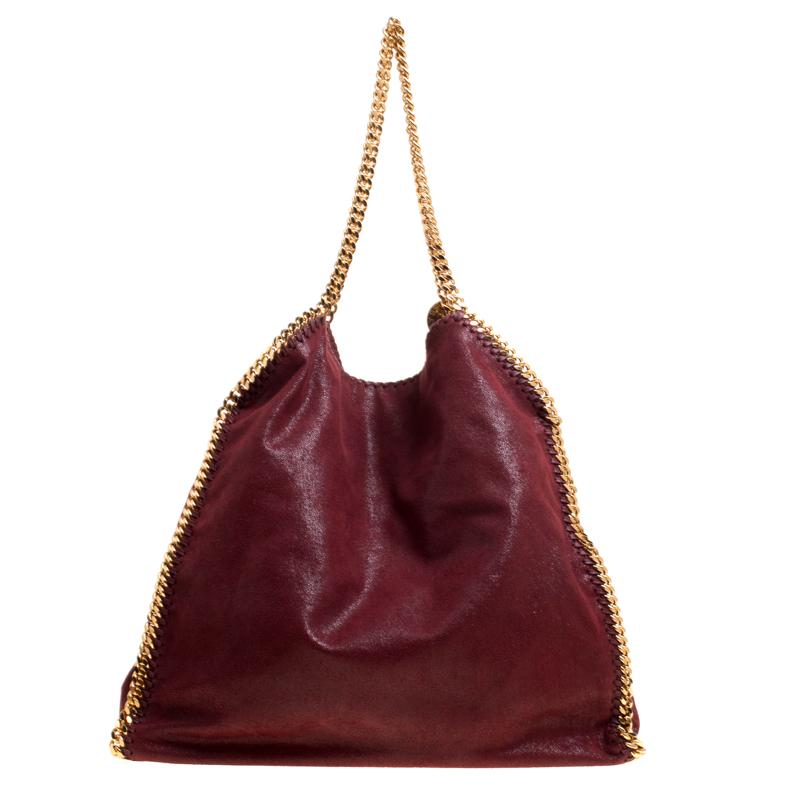 This Falabella tote from Stella McCartney will make the dream of countless women come true. Crafted from faux leather, it is durable and stylish. While the chain detailing elevate its beauty, the nylon-lined interior will dutifully hold all your