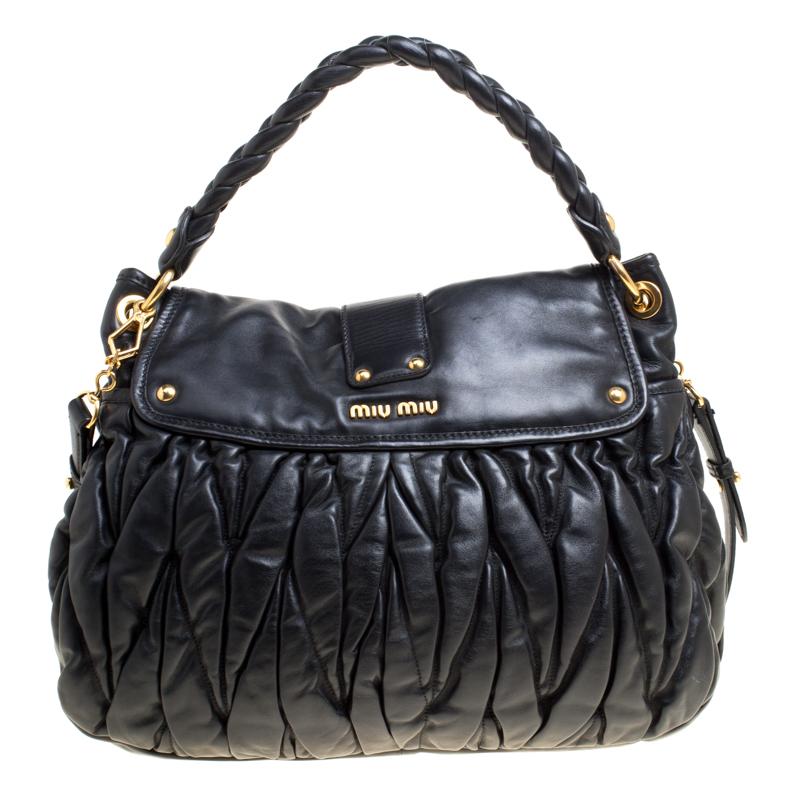 This chic and feminine Coffer hobo is from Miu Miu. The bag is crafted from Matelasse leather and features a flap that opens up to a fabric-lined interior sized to fit your daily essentials. The hobo is equipped with a braided top handle and a