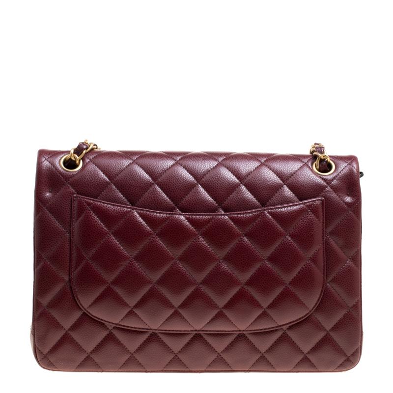 Made in Italy, this stunning caviar double flap bag from Chanel will take your breath away. Perfect for all your outings, the bag is an exotic burgundy shade. Crafted from leather, it features the iconic quilted pattern on it and captures our
