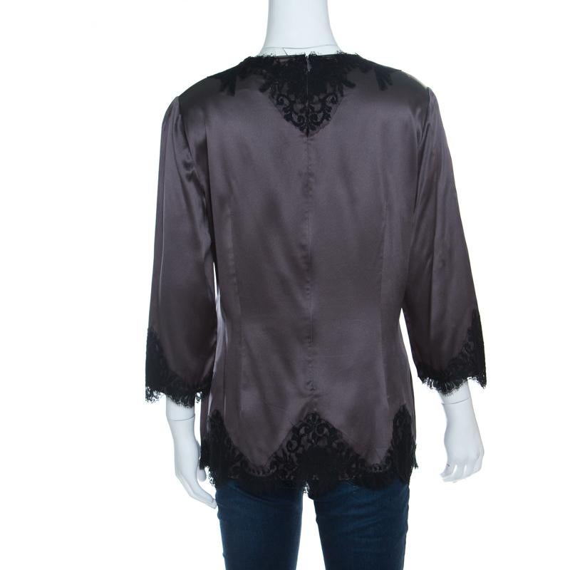 We love this top from Dolce and Gabbana as it is high in style and appeal. Cut from quality fabrics, the top brings long sleeves, scalloped lace inserts and long sleeves. You can team it with pants or skirts and high heels.

Includes: The Luxury