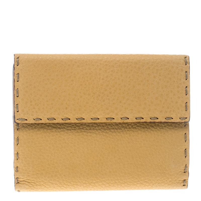 Designed to assist you, this Fendi wallet comes crafted from leather and styled in a bi-fold with their signature Selleria stitches and the brand logo on the front. It has multiple slots and compartments for your cash and cards.

Includes: The