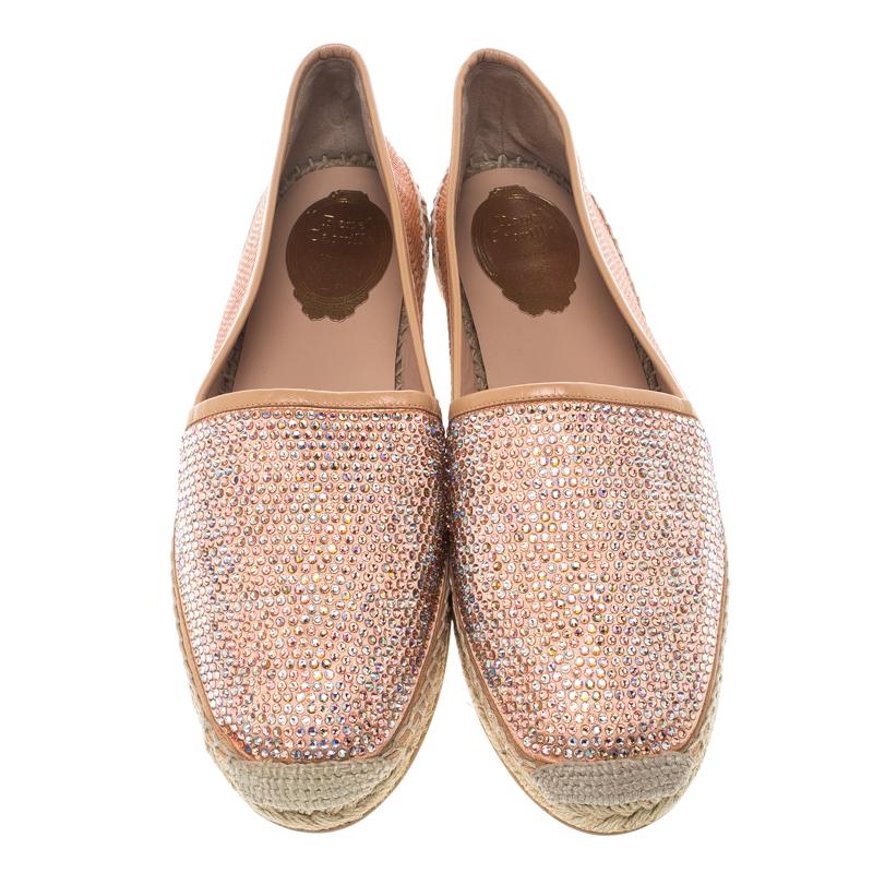 To perfectly highlight your style, René Caovilla brings you this pair of espadrilles that speak nothing but beauty. They've been designed with canvas, leather trims, and on the satin, there are decorations of crystals. The comfortable flats are easy