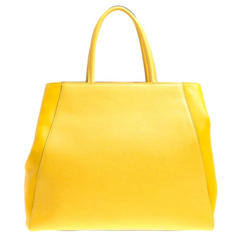 Fendi's 2Jours tote is one of the most iconic designs from the label and it still continues to receive the love of women around the world. Crafted from yellow Saffiano leather, the bag features double rolled handles and a detachable shoulder strap.
