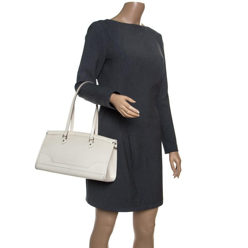 Named after the Parisian church, Place de la Madeleine, this Louis Vuitton bag is an ideal piece for day to night. Crafted from ivory-coloured Epi leather, the bag features a structured exterior, two top handles that can be carried on your shoulder