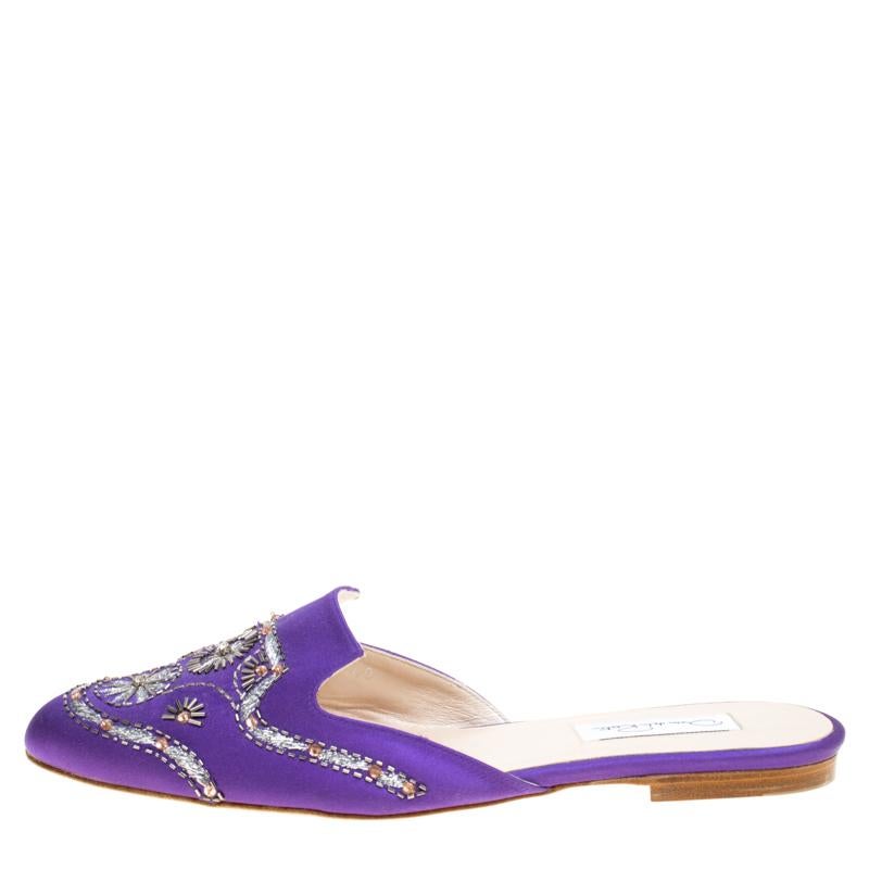 Channel your inner goddess with these stunning Spanish mules from Oscar De La Renta that will make you look divine. These shimmering purple mules are crafted from satin and feature exquisite embellishment detailing at the front which is absolutely