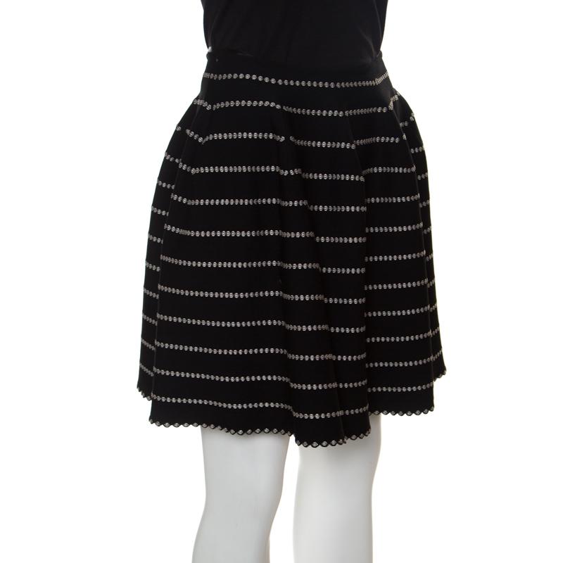 Who says only dresses can make you look chic and stylish when you have this fabulous mini skirt from Alaia that spells elegance. This high waist skirt is made of a blend of fabrics and features a monochrome embossed jacquard knit pattern all over