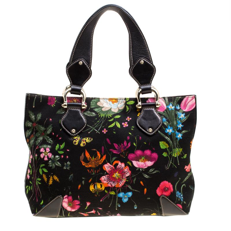 You know what would be the perfect tote to swing for your daily errands or sprees? This one here from Gucci. It is perfect! Crafted from floral-printed canvas, the bag has a lovely shape, two leather handles and a spacious canvas