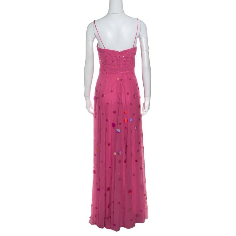 You'll leave onlookers stunned when you step out wearing this scintillating maxi dress from Badgley Mischka. The pink creation is made of 100% nylon and features a draped silhouette. It flaunts sequin paillettes embellished all over and a deep