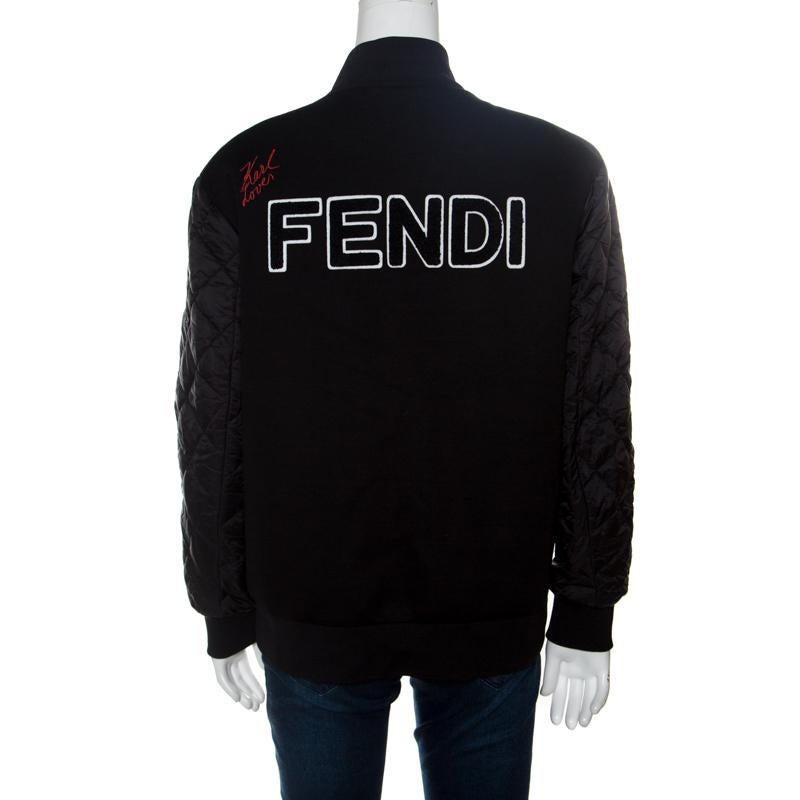 Celebrating its creative director-Karl Lagerfield, this Karlito bomber jacket from Fendi spells luxury like no other. The chic black jacket is made of a blend of fabrics and features Karl's face logo applique detailing on the front. It flaunts front