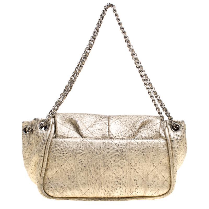 That gorgeous dress of yours needs the perfect accessory and what better than this bag from Chanel. Shimmering in light gold, this bag is crafted from leather and features a chic silhouette. It flaunts a front flap closure with the signature CC logo