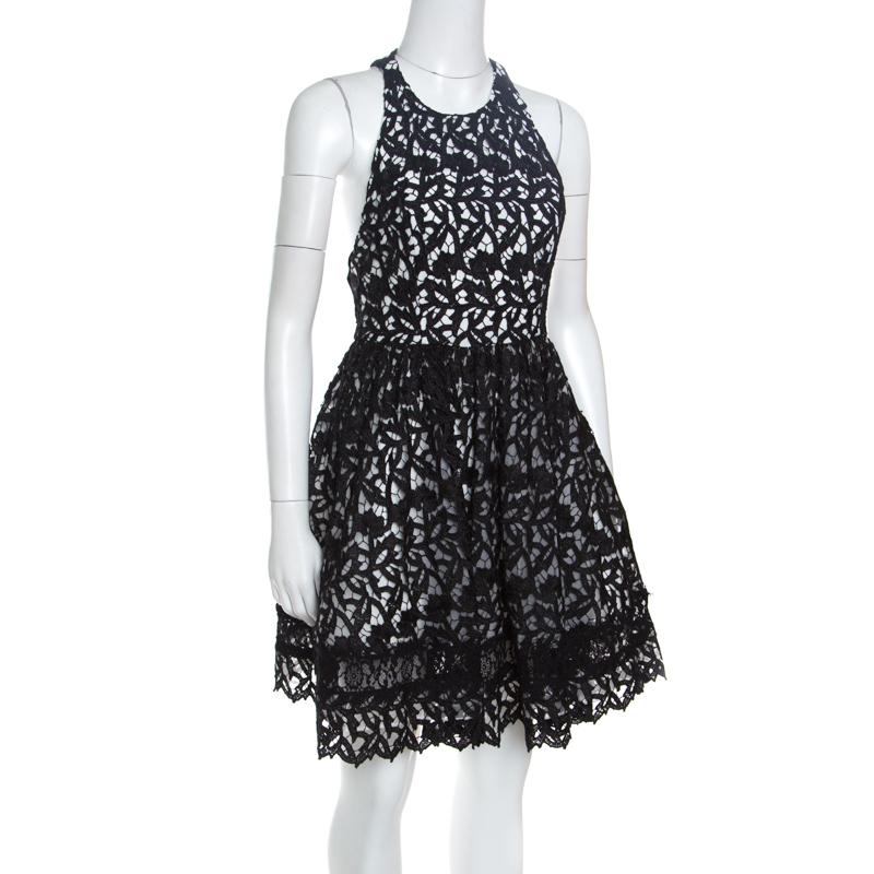 This Mariel dress is a testimony of Alice + Olivia's wonderful approach to fashion. This pretty black dress is meticulously designed with Guipure lacework that creates an overlay. A sleeveless design with a racer back, it is equipped with a round