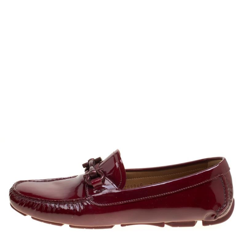 These loafers from Salvatore Ferragamo are not only high on appeal but also very skilfully made. They have been crafted from cherry red patent leather in Italy and designed with beauty using neat stitching and the Gancio Bit on the uppers. The