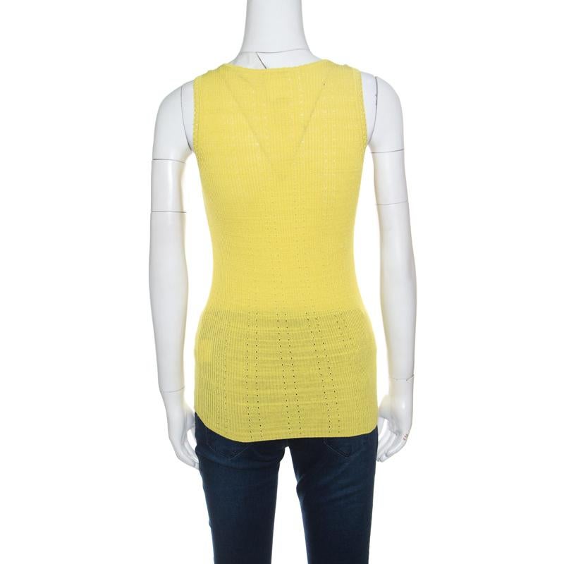 It's impressive how such a simple style looks so exquisite; this Chanel top has been beautifully crafted in a blend of cotton and nylon with perforated patterns. The yellow top is accentuated with ribbed knitting and features the signature CC