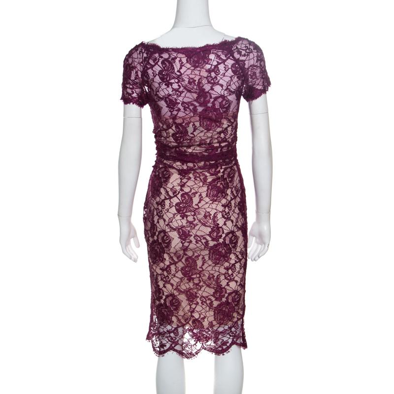 Everything about this Emilio Pucci dress is glamorous and ultra-modern. Crafted with feminine aesthetics in a bodycon style, this pretty dress features short sleeves and a broad neckline. Slightly ruched and adorned with floral lacework and