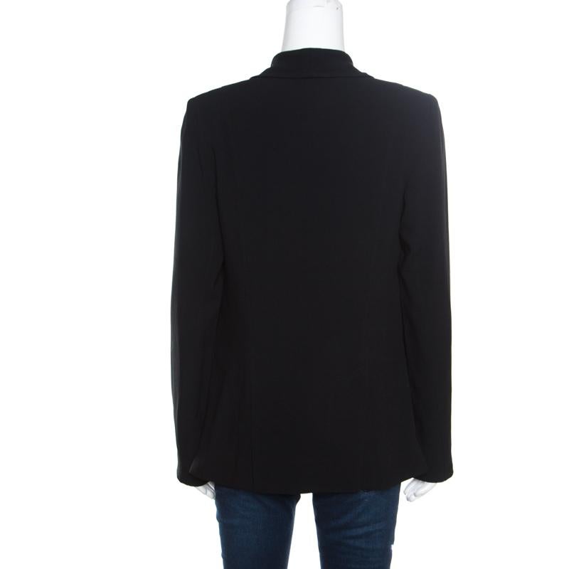 If you're in the mood for some power dressing, then this 10 Crosby Derek Lam blazer is just perfect for you! The black creation is made of crepe and features a layered silhouette. It flaunts shawl lapels, a faux vest detailing, a front button