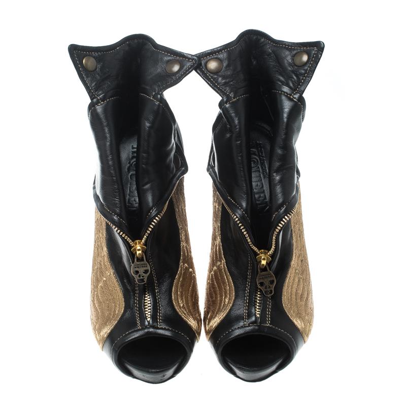 If you're someone who has a love for things that are edgy and unique, then Alexander McQueen's designs are perfect for you. These McQueen ankle boots are anything but dull. Luxuriously crafted from leather, they feature peep toes, wing embroidery,