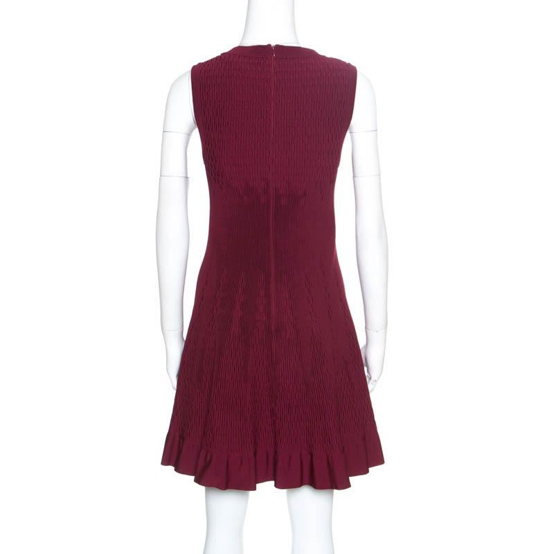 Isn't this sleeveless dress from Alaia just wonderful! The maroon creation is made of a blend of fabrics and features a pleated silhouette. It flaunts a square neckline and comes equipped with a concealed zip closure at the back. Pait it with